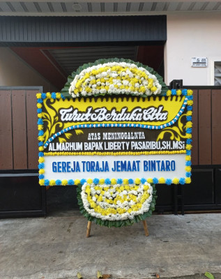 Papan Bunga Duka di Doko