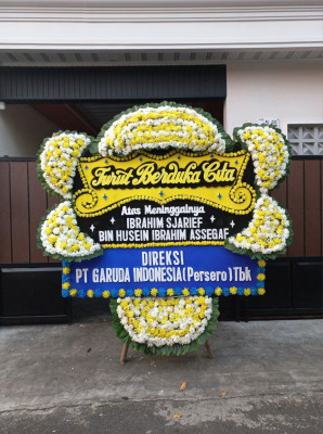 Papan Bunga Duka di Doko